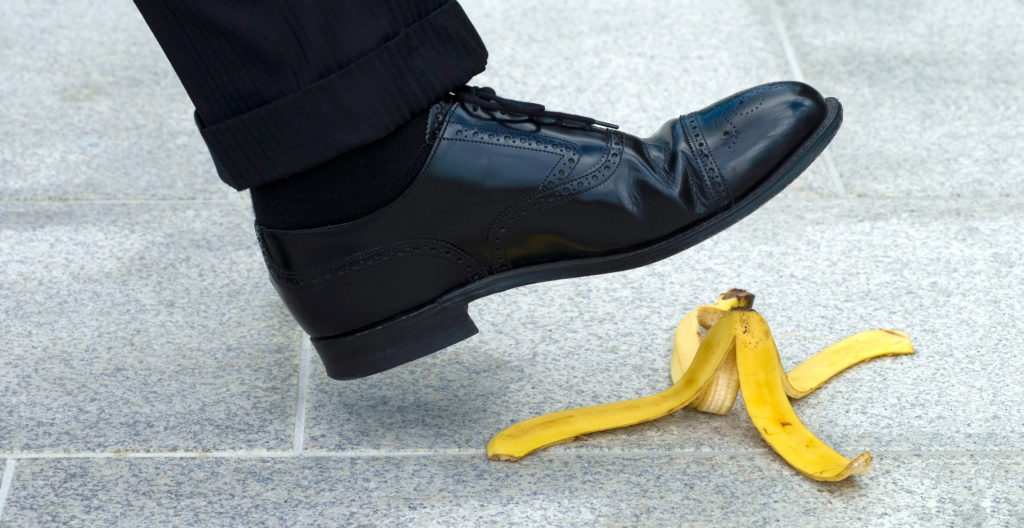 Shoe hovering over a banana skin